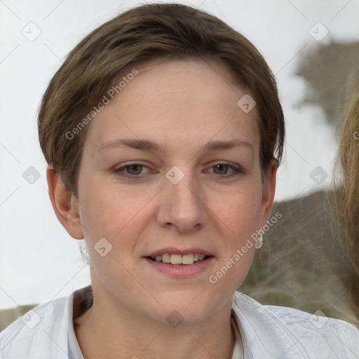 Joyful white young-adult female with short  brown hair and grey eyes