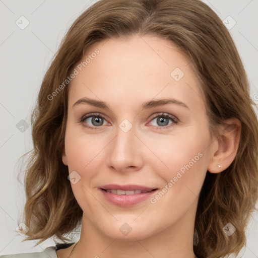 Joyful white young-adult female with medium  brown hair and green eyes