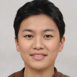 Joyful asian young-adult female with short  brown hair and brown eyes