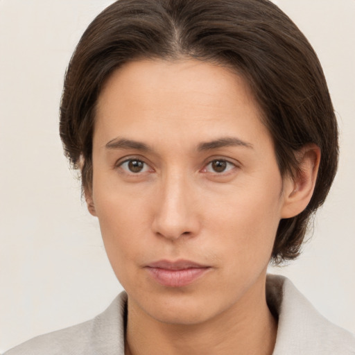 Neutral white young-adult female with medium  brown hair and brown eyes