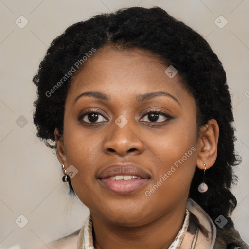 Joyful black young-adult female with long  black hair and brown eyes