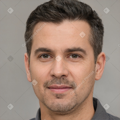 Joyful white adult male with short  brown hair and brown eyes