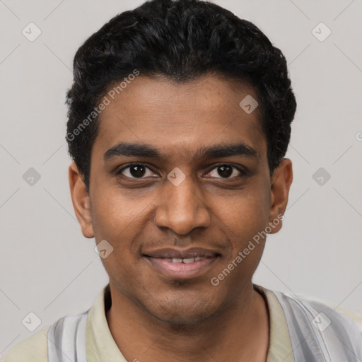 Joyful black young-adult male with short  black hair and brown eyes