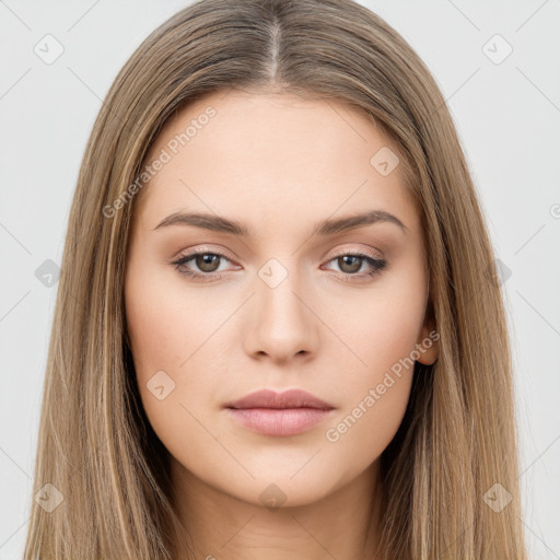 Neutral white young-adult female with long  brown hair and brown eyes