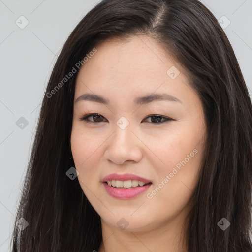 Joyful asian young-adult female with long  brown hair and brown eyes