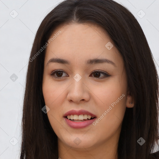 Joyful asian young-adult female with long  brown hair and brown eyes