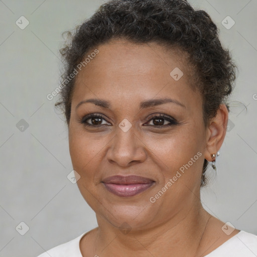 Joyful black adult female with short  brown hair and brown eyes