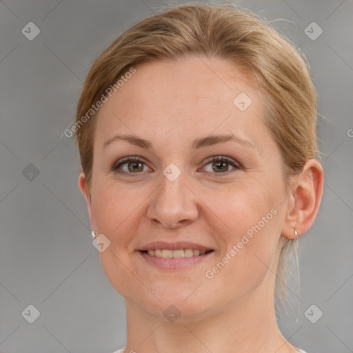 Joyful white adult female with medium  brown hair and grey eyes