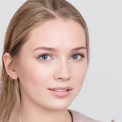 Joyful white young-adult female with long  brown hair and blue eyes