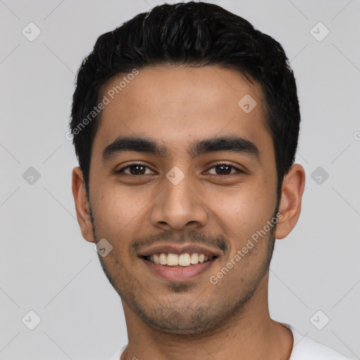 Joyful latino young-adult male with short  black hair and brown eyes