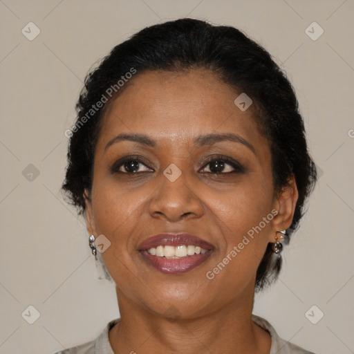 Joyful black adult female with short  brown hair and brown eyes