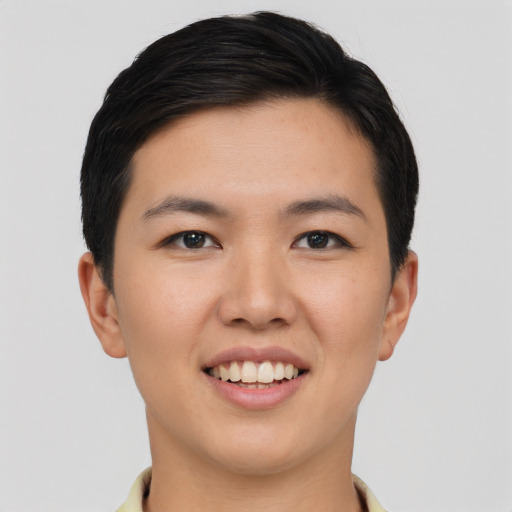Joyful asian young-adult female with short  black hair and brown eyes