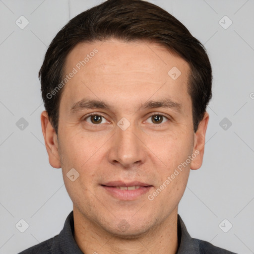 Joyful white adult male with short  brown hair and brown eyes