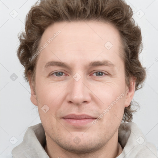 Joyful white adult male with short  brown hair and grey eyes