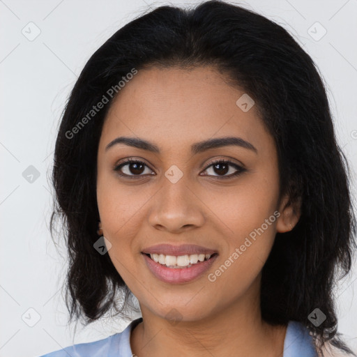 Joyful latino young-adult female with long  black hair and brown eyes