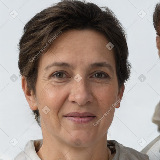 Joyful white adult female with short  brown hair and brown eyes