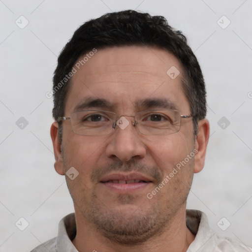 Joyful white adult male with short  brown hair and brown eyes