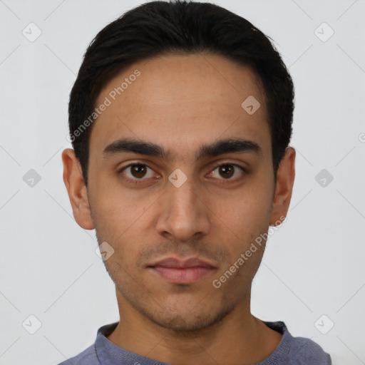 Neutral latino young-adult male with short  black hair and brown eyes