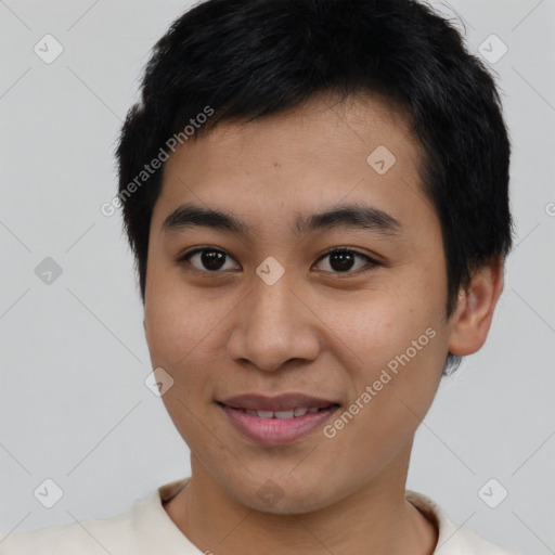 Joyful asian young-adult male with short  black hair and brown eyes