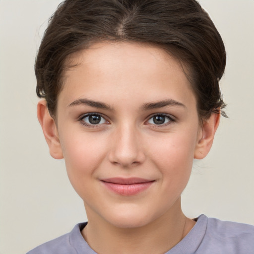 Joyful white child female with short  brown hair and brown eyes