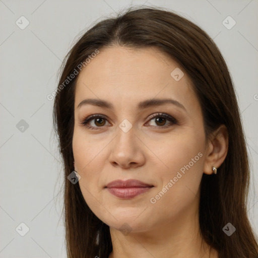 Joyful white young-adult female with long  brown hair and brown eyes