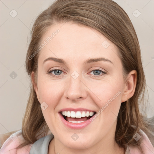 Joyful white young-adult female with medium  brown hair and blue eyes