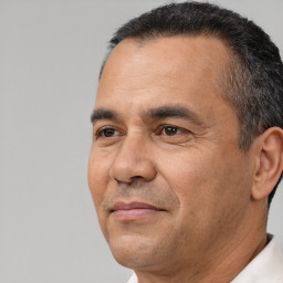 Joyful white adult male with short  black hair and brown eyes