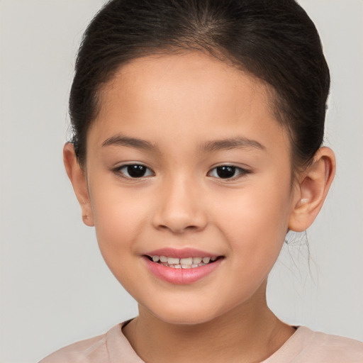 Joyful white child female with short  brown hair and brown eyes