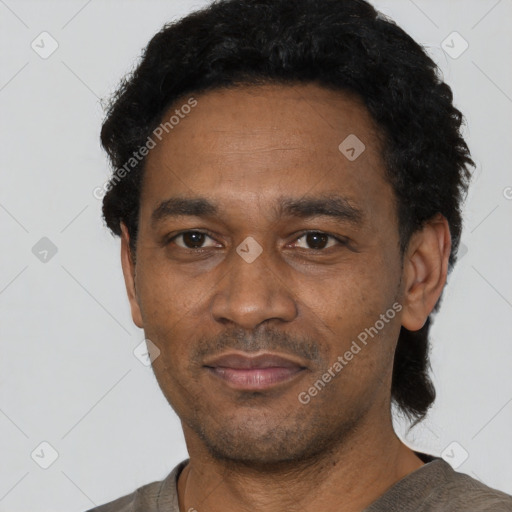 Neutral latino adult male with short  black hair and brown eyes