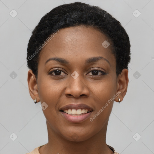 Joyful black young-adult female with short  black hair and brown eyes