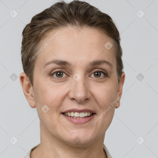 Joyful white adult female with short  brown hair and grey eyes