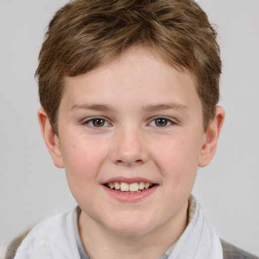 Joyful white child male with short  brown hair and brown eyes