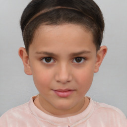 Joyful white child female with short  brown hair and brown eyes