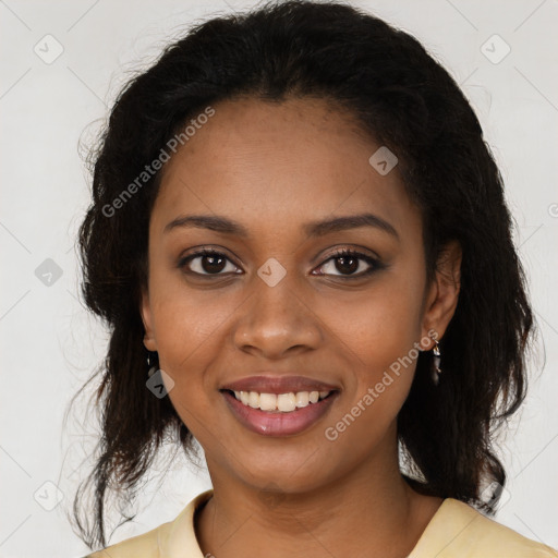 Joyful black young-adult female with medium  brown hair and brown eyes