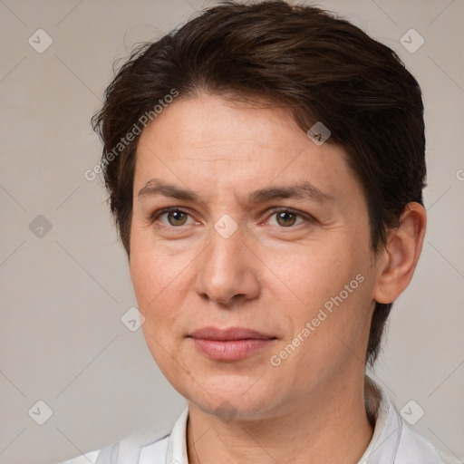 Joyful white adult female with short  brown hair and brown eyes