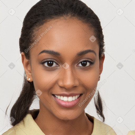 Joyful black young-adult female with long  brown hair and brown eyes