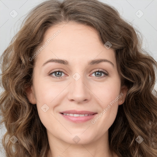 Joyful white young-adult female with long  brown hair and green eyes