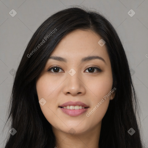 Joyful asian young-adult female with long  black hair and brown eyes