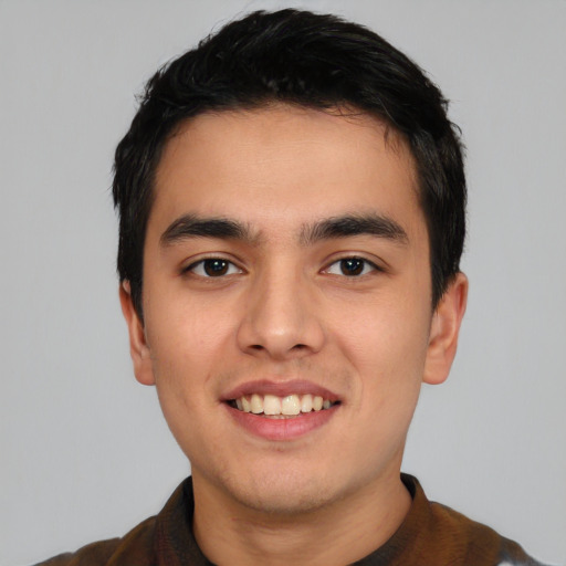 Joyful asian young-adult male with short  black hair and brown eyes