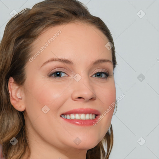 Joyful white young-adult female with long  brown hair and blue eyes