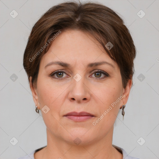 Joyful white adult female with short  brown hair and grey eyes