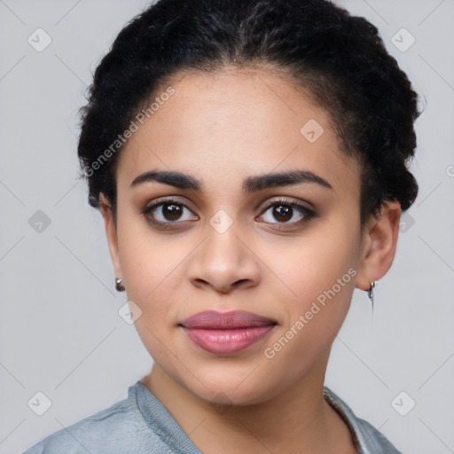 Joyful latino young-adult female with short  black hair and brown eyes