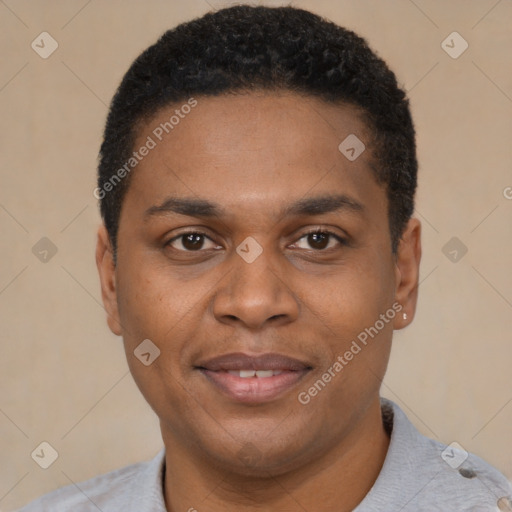 Joyful black young-adult male with short  brown hair and brown eyes