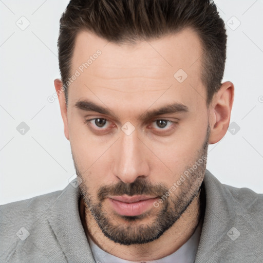 Neutral white young-adult male with short  brown hair and brown eyes