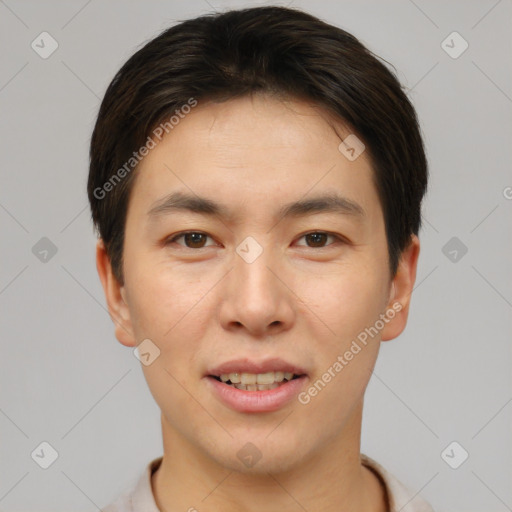 Joyful asian young-adult male with short  brown hair and brown eyes