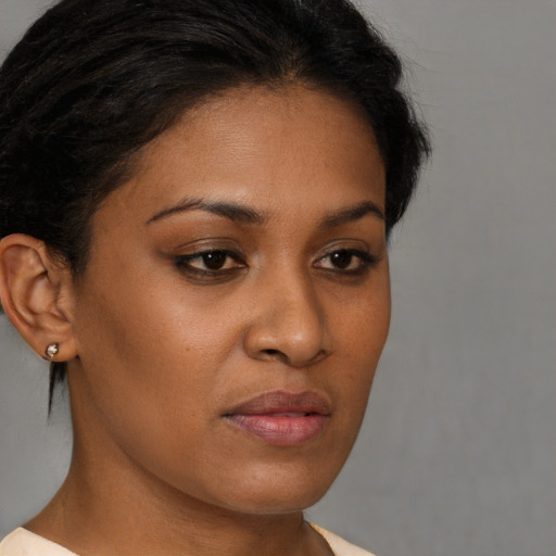 Neutral black young-adult female with short  brown hair and brown eyes
