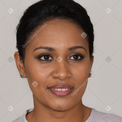 Joyful black young-adult female with short  black hair and brown eyes