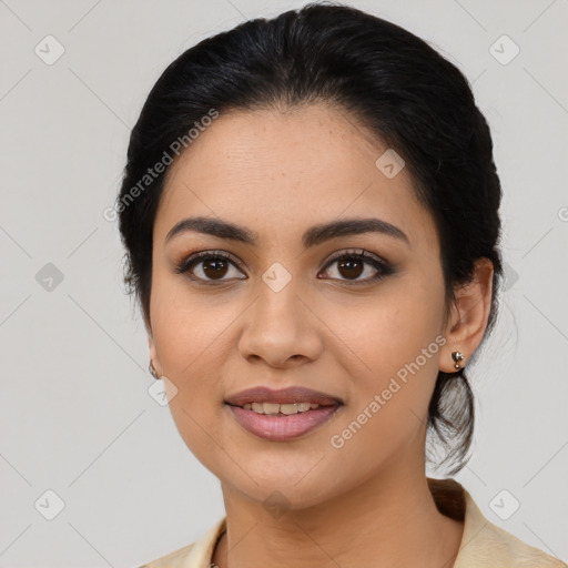 Joyful latino young-adult female with medium  black hair and brown eyes