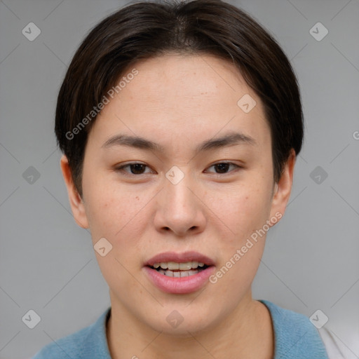 Joyful asian young-adult female with short  brown hair and brown eyes