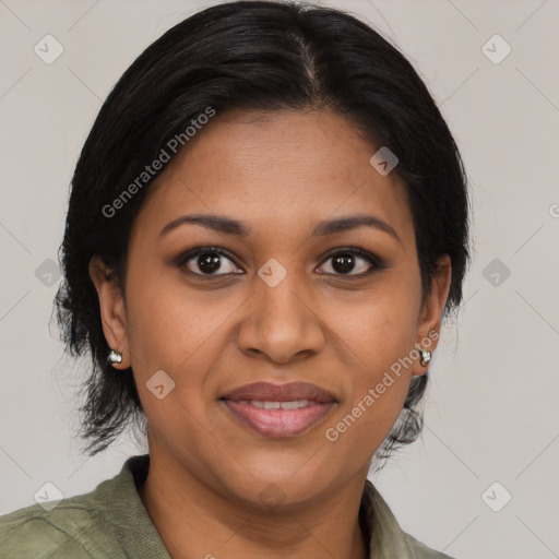 Joyful black adult female with medium  brown hair and brown eyes